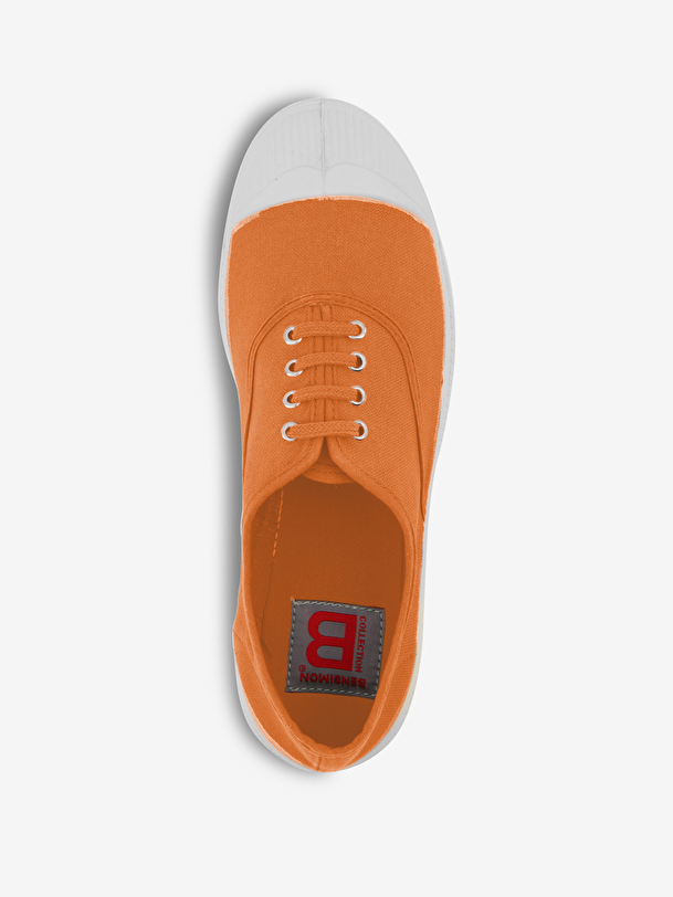 woman lace-up tennis coral